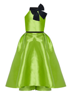 Green dress with a black bow on a white background