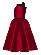 Red dress with black accents on a white background
