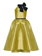 Gold dress with black bow on a white background