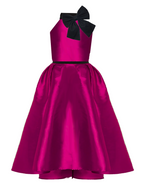 Pink dress with black bow on a white background