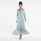 Woman wearing a light blue dress with a white background