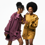 Two women wearing floral dresses on a white background