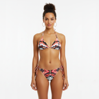 Woman wearing a floral bikini set on a white background