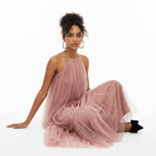 Woman wearing a pink tulle dress on a white background