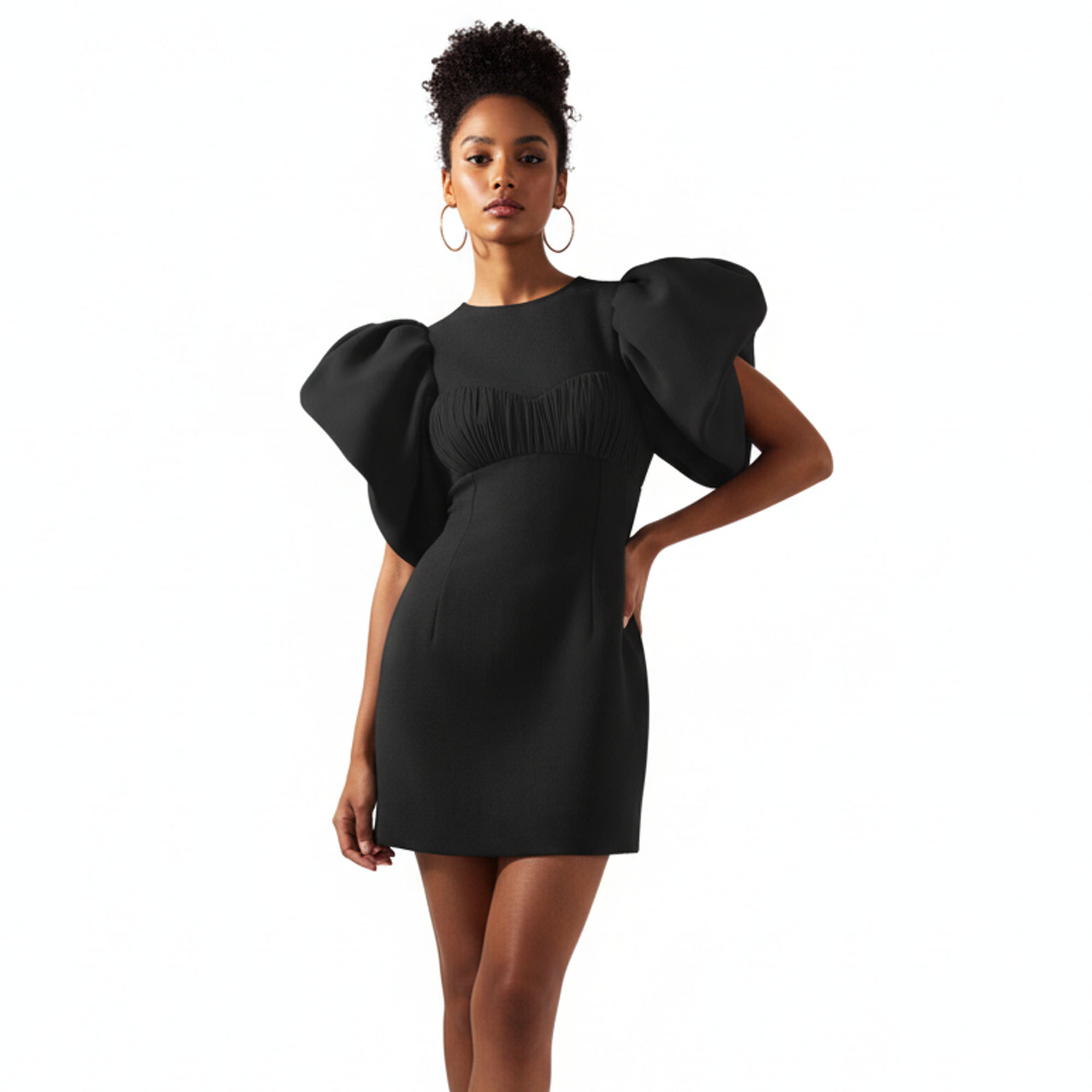Woman wearing a black dress with puffed sleeves on a white background