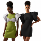 Two women wearing puff-sleeve dresses in green and black.