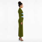 Woman wearing a green outfit with a white background