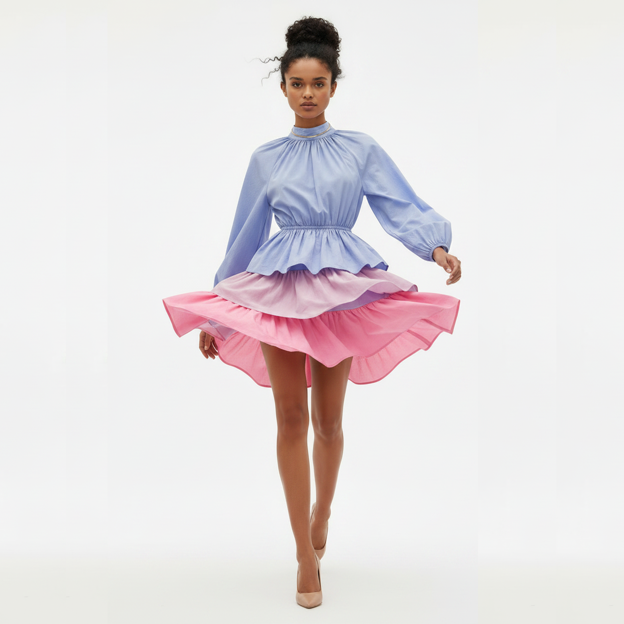 Woman wearing a two-tone dress with blue top and pink skirt on a white background