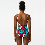Colorful swimsuit with abstract design on a plain background