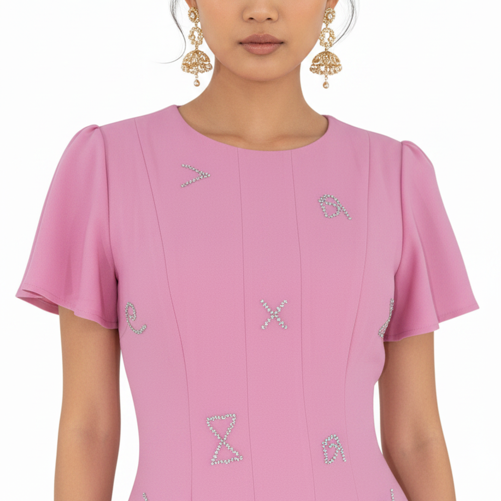Pink dress with decorative elements on a white background