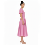 Woman wearing a pink dress on a white background