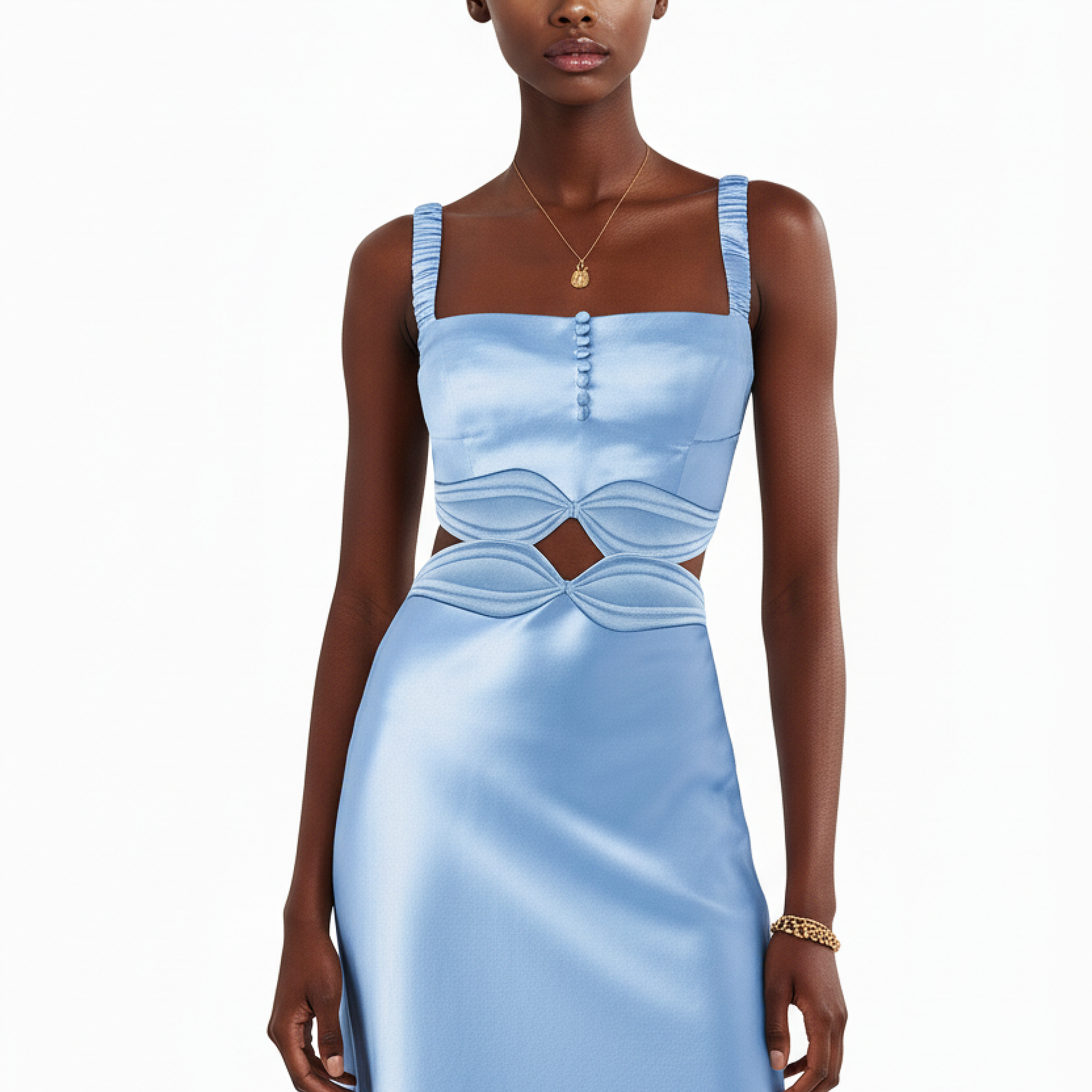 Woman wearing a light blue dress with cut-out design on a white background