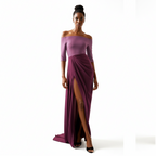 Woman wearing a purple off-shoulder gown with a slit on a white background