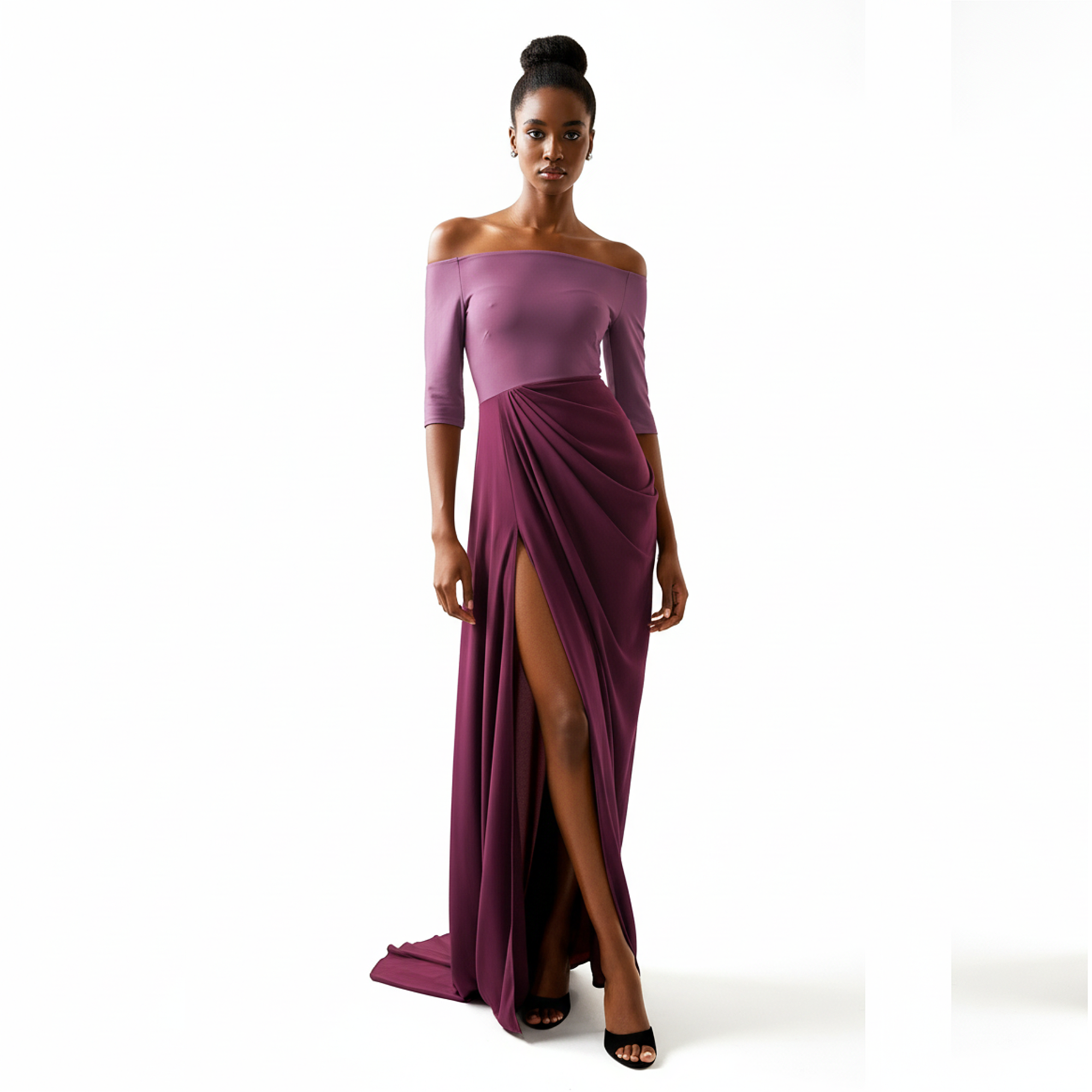 Woman wearing a purple off-shoulder gown with a slit on a white background