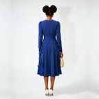Woman wearing a blue dress on a white background