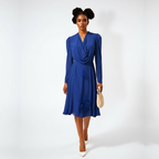 Woman wearing a blue dress against a white background