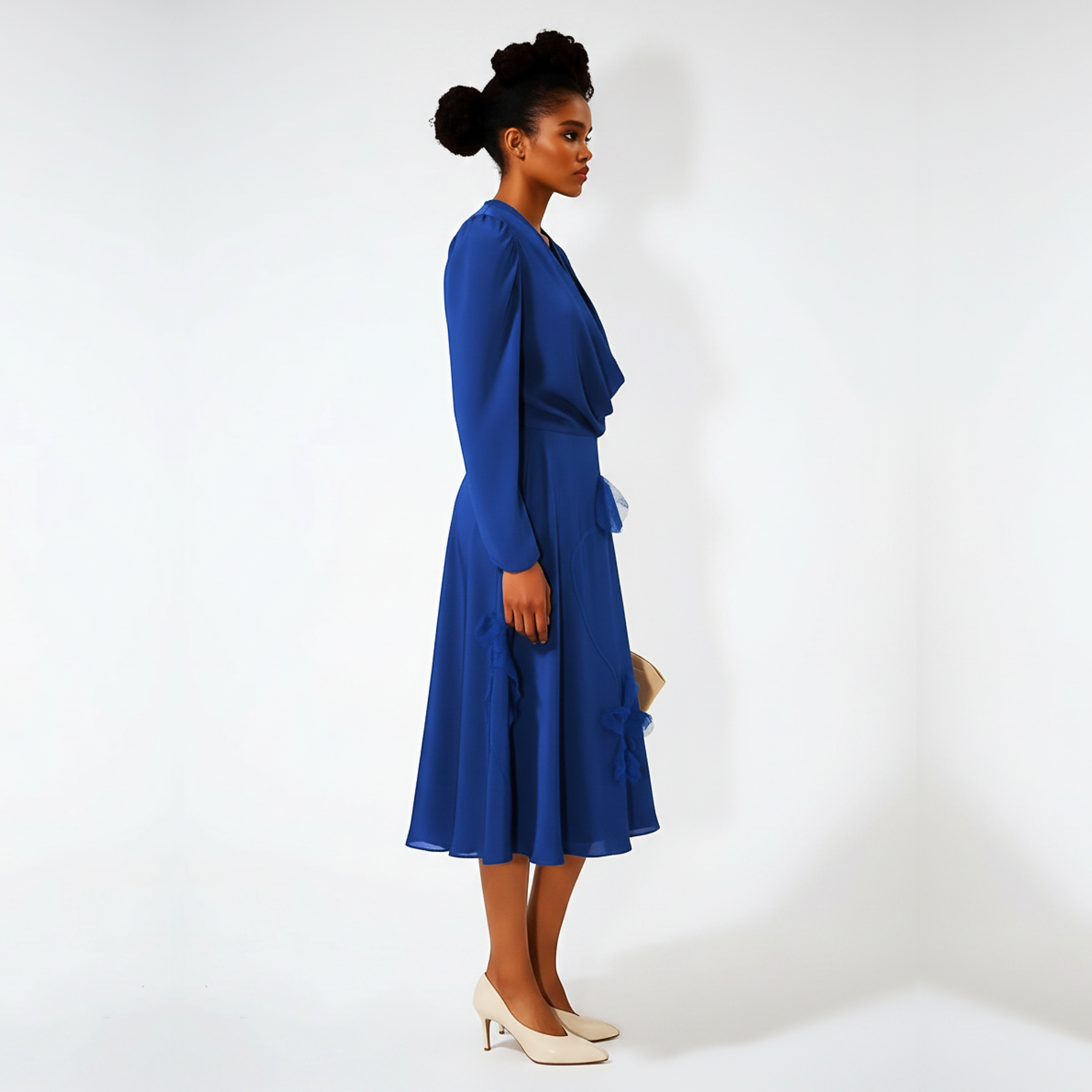Woman wearing a blue dress against a white background