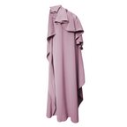 Pink one-shoulder dress with ruffle details on a white background