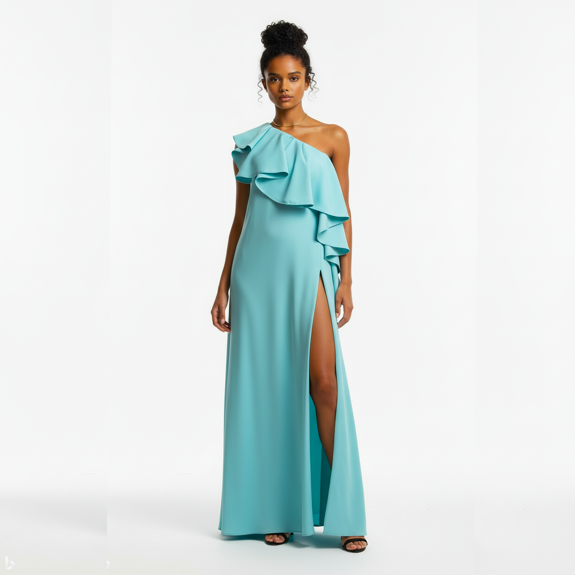 Woman wearing a turquoise one-shoulder gown with a slit on a white background