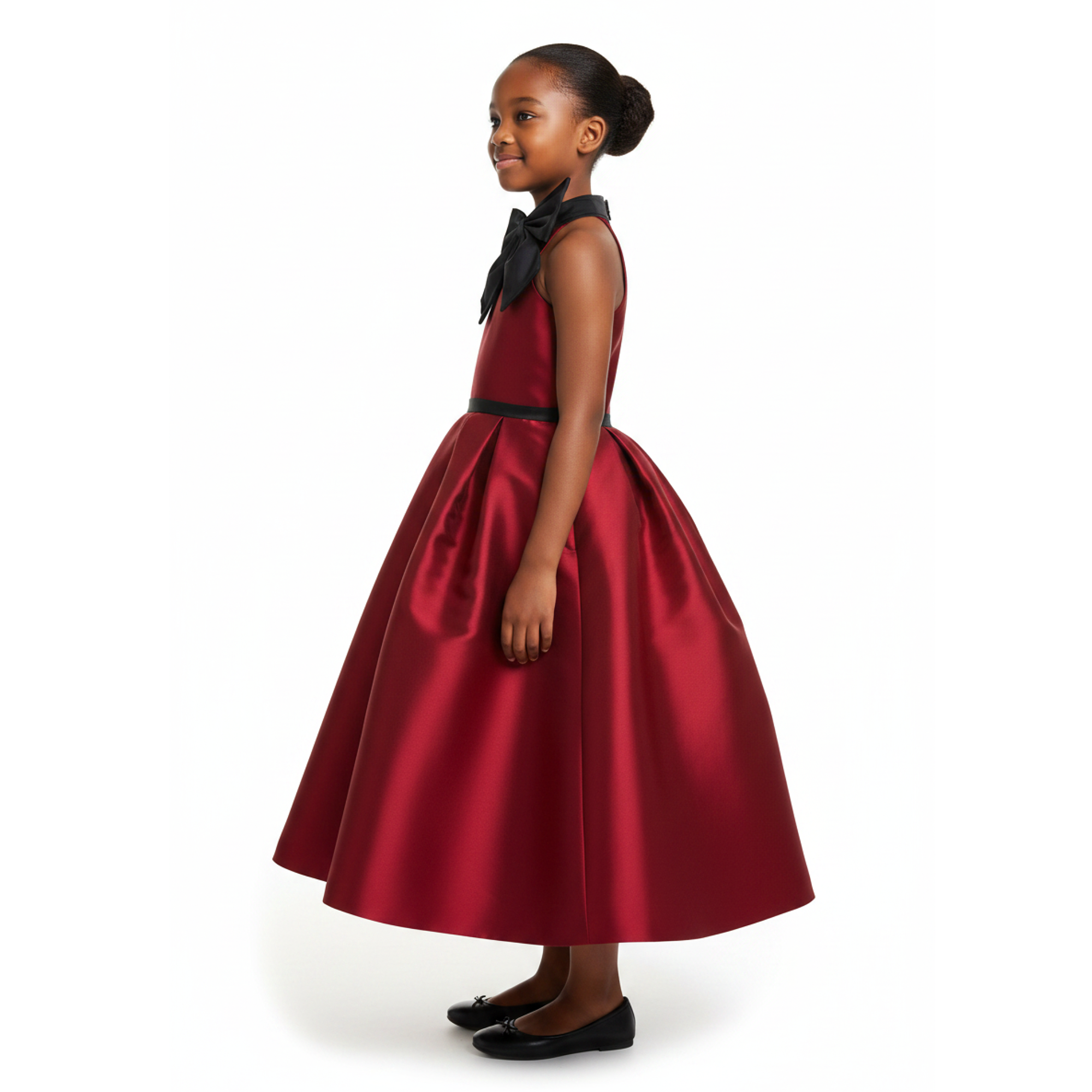 A girl wearing a wine red dress with black bow on a white background