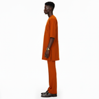 Man wearing an orange outfit on a white background