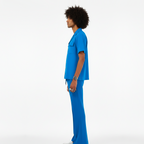 Person wearing a blue outfit on a white background