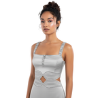 Woman wearing a light gray dress with cut-out design on a white background