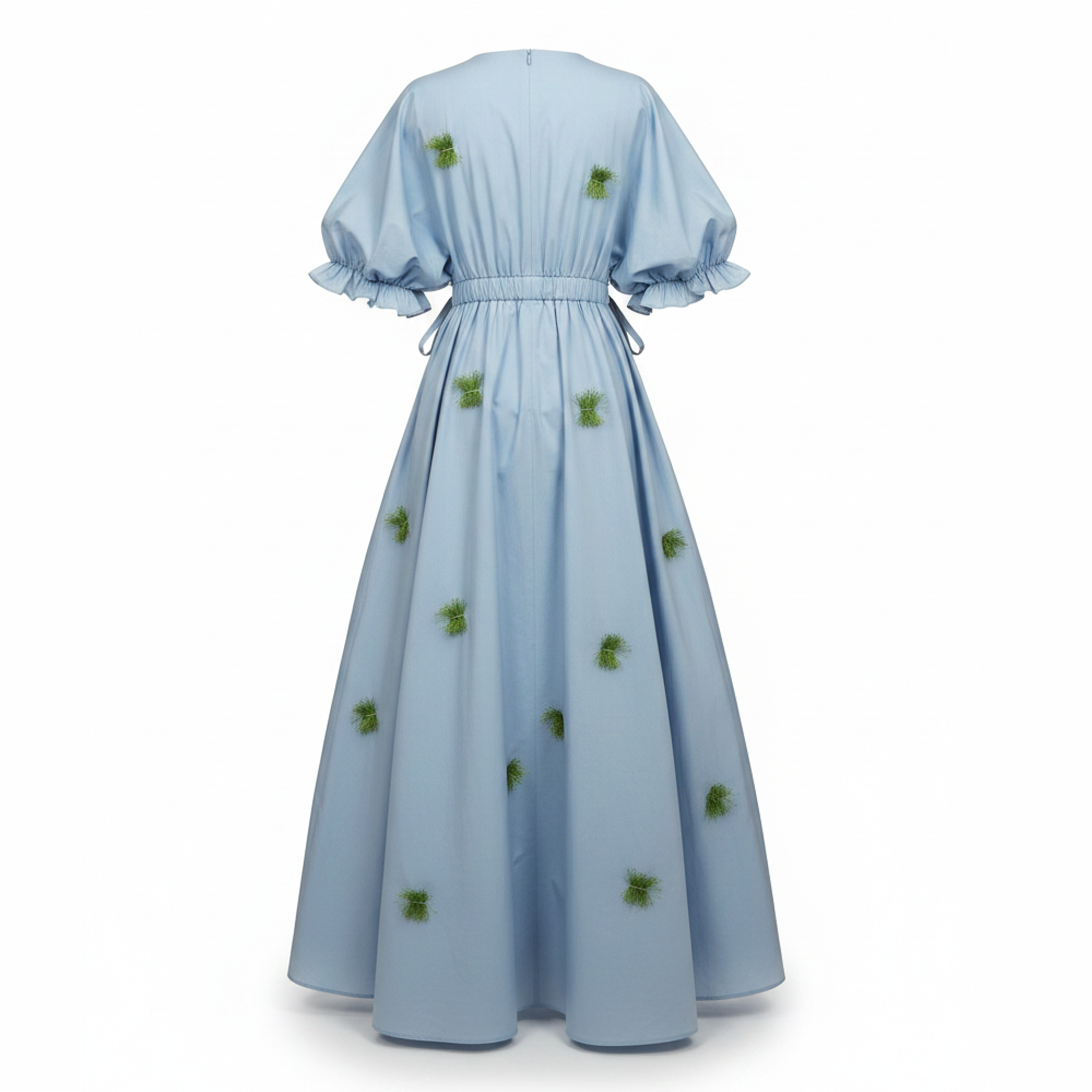 Light blue dress with green floral patterns on a white background