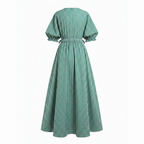 Green checkered dress on a white background
