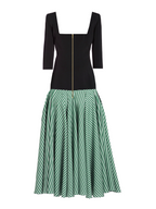 Black top and green checkered skirt on a white background