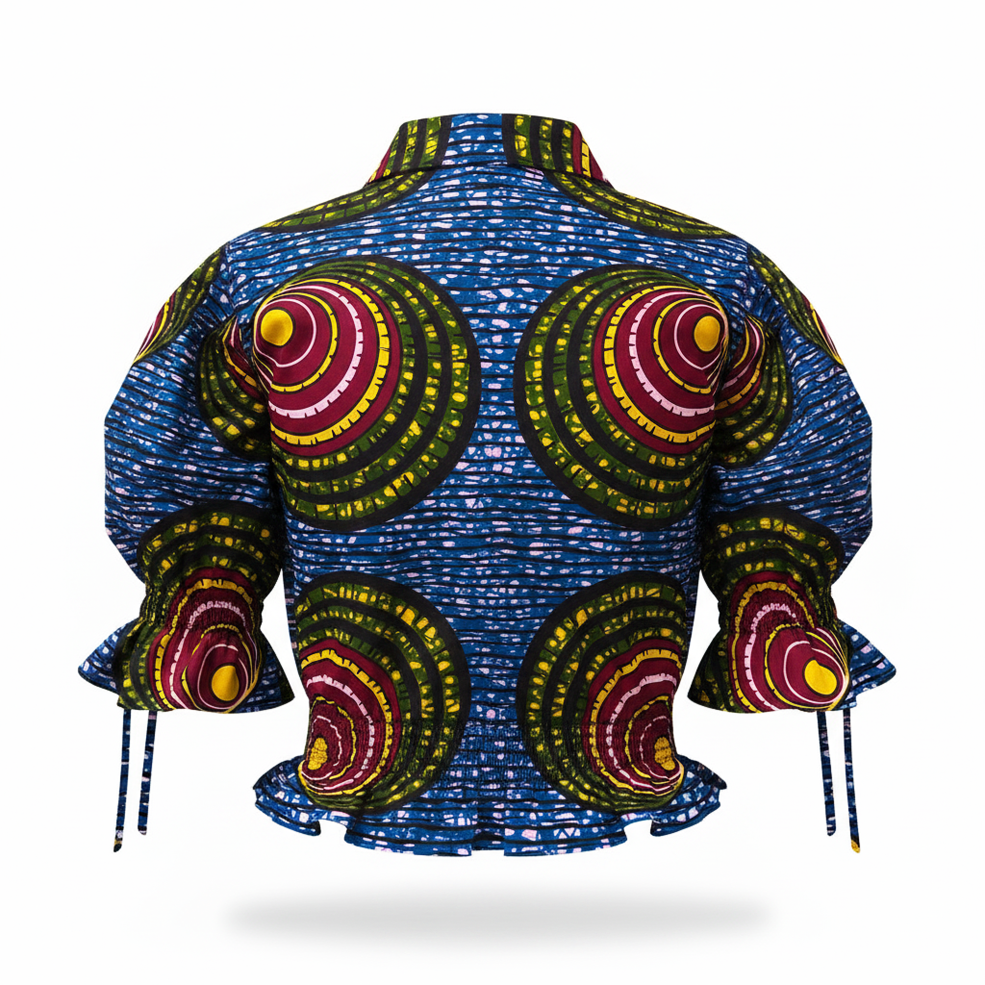 A cropped long-sleeve blouse with a high mock neck, featuring a vibrant blue base with white dash patterns and large circular motifs in green, yellow, and red on the chest and sleeves.