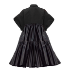 Black dress with a tiered skirt on a white background